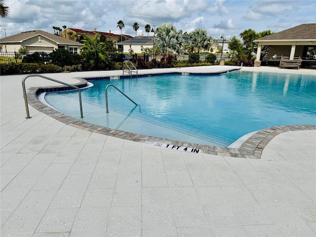 view of swimming pool with a patio area