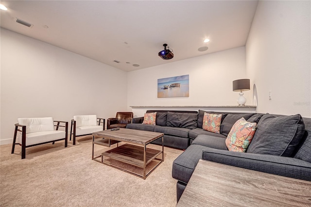 living room featuring recessed lighting, carpet floors, and visible vents