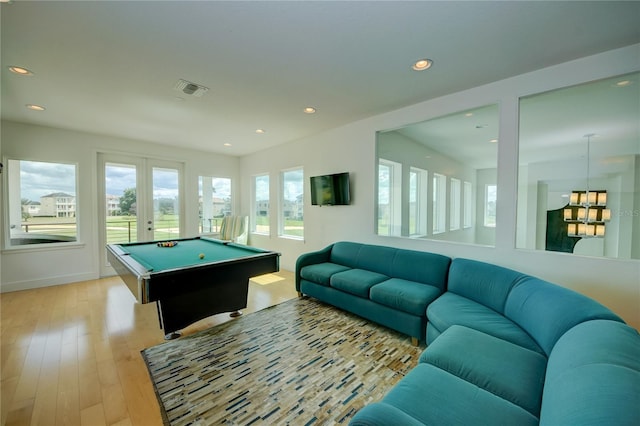 recreation room featuring french doors, pool table, and light wood-type flooring