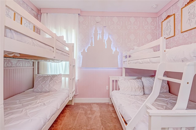 bedroom featuring wallpapered walls, carpet floors, and multiple windows