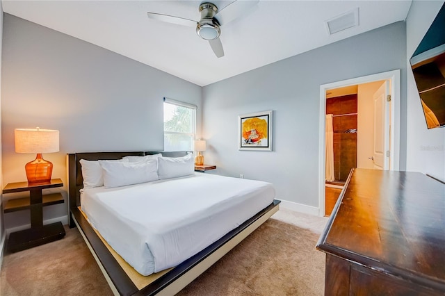 bedroom with light colored carpet, ceiling fan, baseboards, and visible vents
