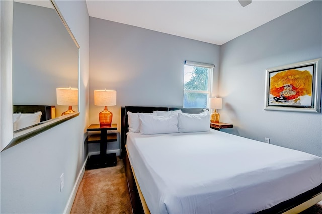 bedroom featuring carpet floors and baseboards