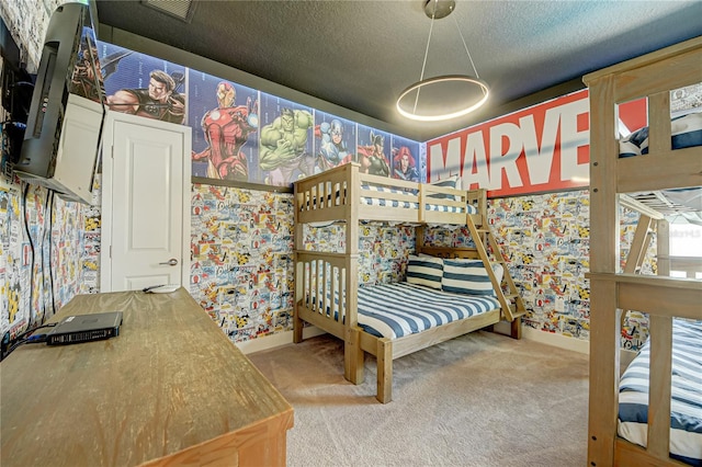 carpeted bedroom with a textured ceiling