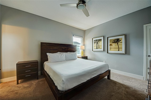 carpeted bedroom with baseboards and ceiling fan