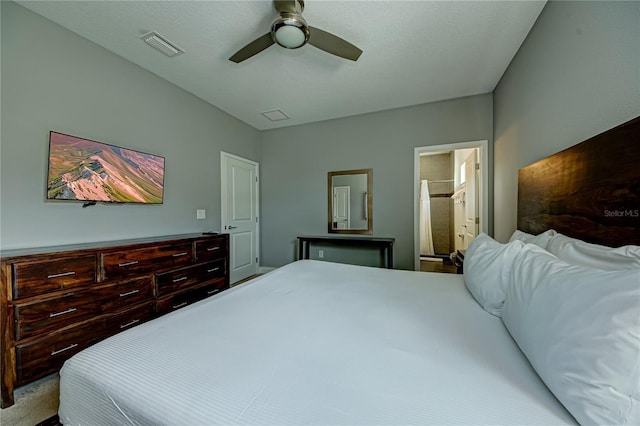 bedroom featuring visible vents, a ceiling fan, and ensuite bathroom