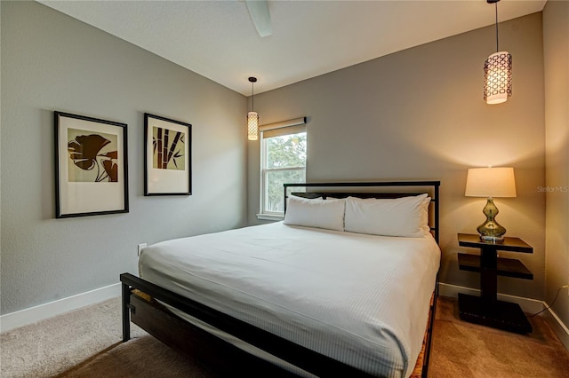 carpeted bedroom with baseboards