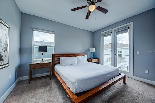 bedroom with dark carpet, multiple windows, access to outside, and ceiling fan