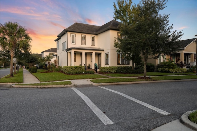 view of front of home with a lawn