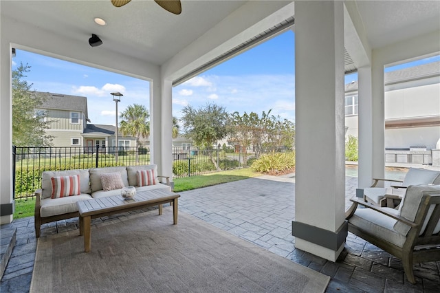 view of patio with outdoor lounge area and ceiling fan