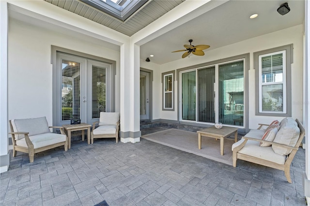 view of patio / terrace with ceiling fan and french doors