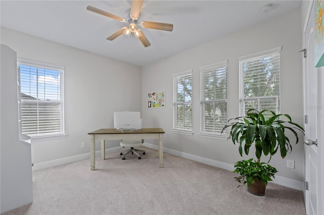 office with light carpet, plenty of natural light, and ceiling fan