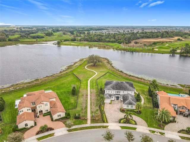 birds eye view of property with a water view