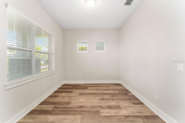 spare room featuring hardwood / wood-style floors