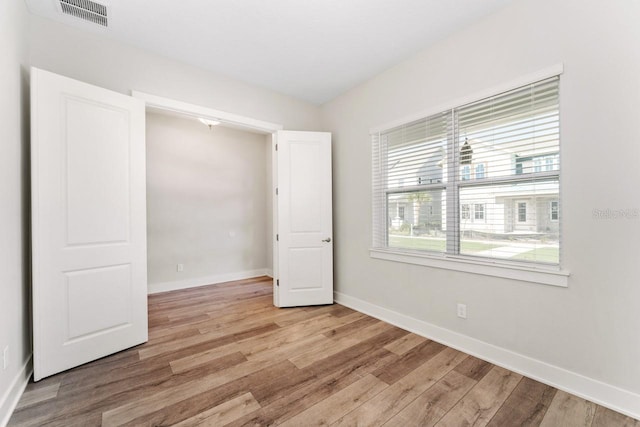 unfurnished bedroom featuring light wood-type flooring