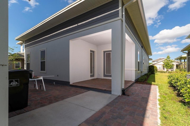 rear view of house with a patio