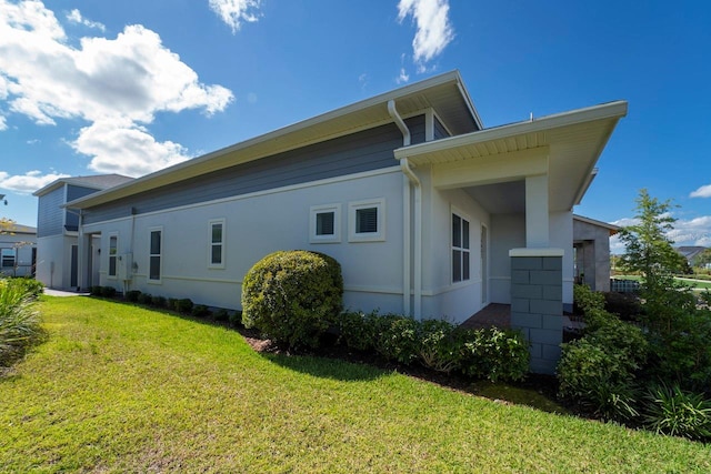 view of home's exterior featuring a yard