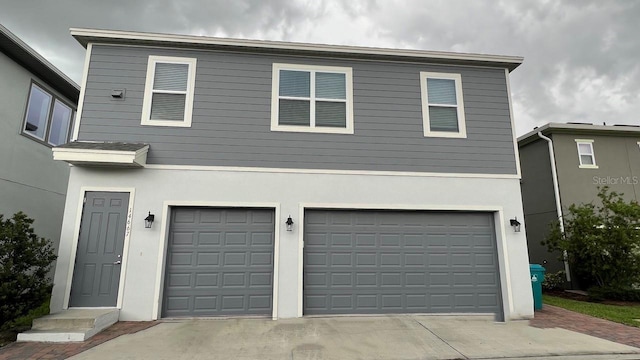 front facade with a garage