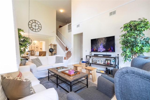 living room featuring a high ceiling