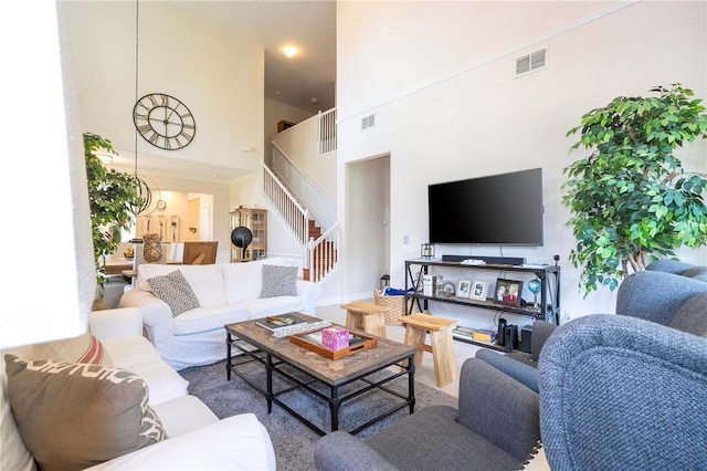 living room featuring a high ceiling