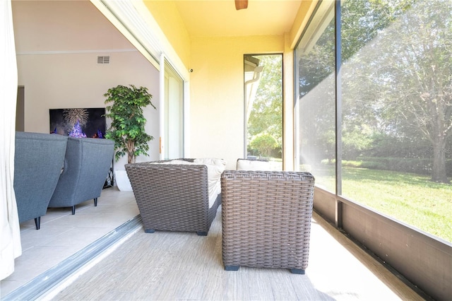 sunroom / solarium featuring visible vents