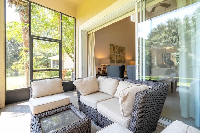 sunroom / solarium with ceiling fan