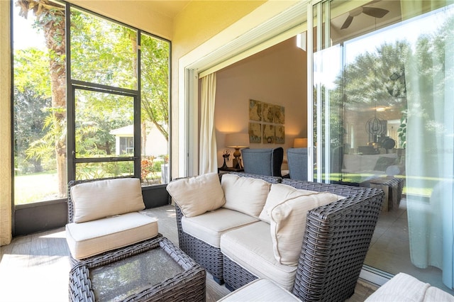 sunroom featuring a healthy amount of sunlight and outdoor lounge area