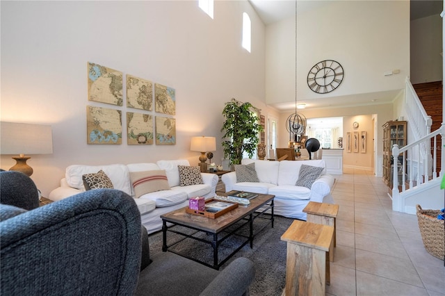 tiled living room featuring a towering ceiling