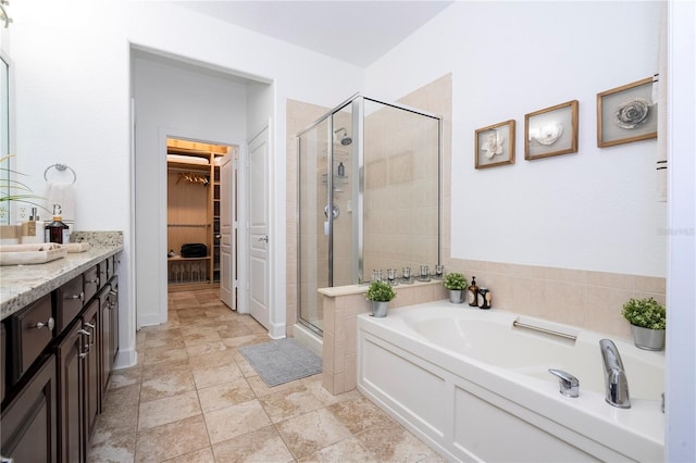 bathroom featuring independent shower and bath and vanity