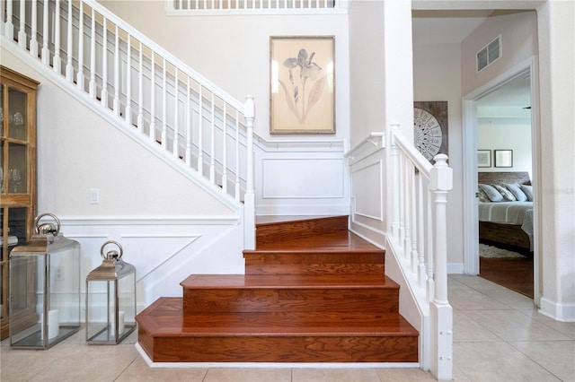 stairway featuring tile patterned floors