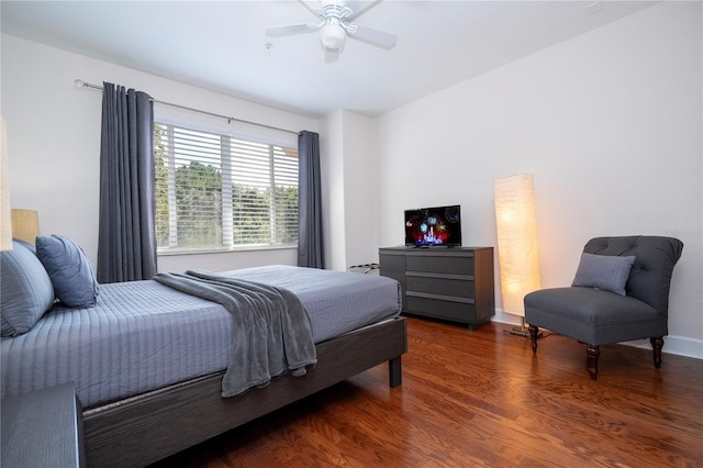 bedroom with ceiling fan and dark hardwood / wood-style flooring