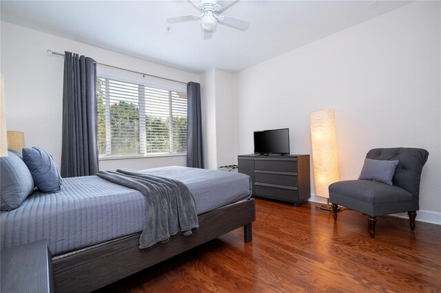 bedroom featuring ceiling fan and dark hardwood / wood-style floors