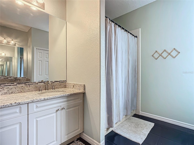 bathroom with vanity and walk in shower