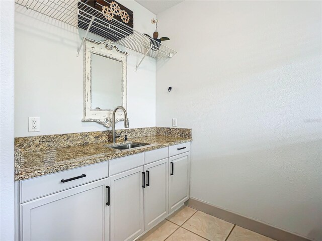 bathroom with tile patterned floors and vanity