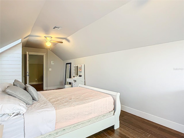 bedroom featuring ceiling fan, dark wood-type flooring, and lofted ceiling