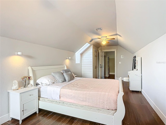 bedroom featuring dark hardwood / wood-style flooring, vaulted ceiling, and ceiling fan