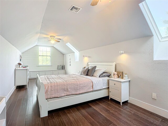 bedroom with ceiling fan, dark hardwood / wood-style flooring, and vaulted ceiling