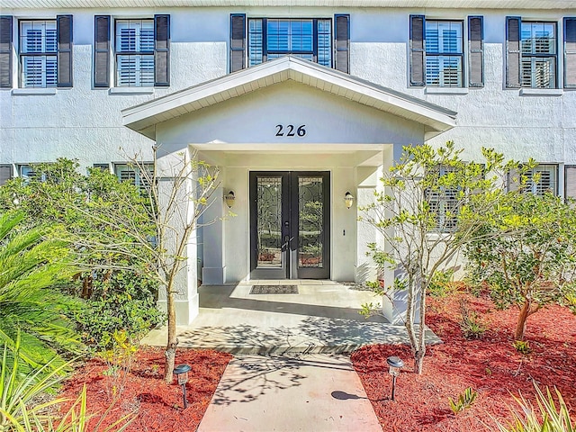 doorway to property featuring french doors