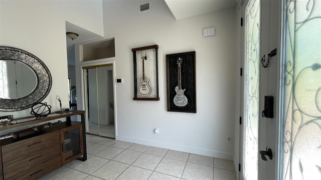 corridor featuring light tile patterned flooring