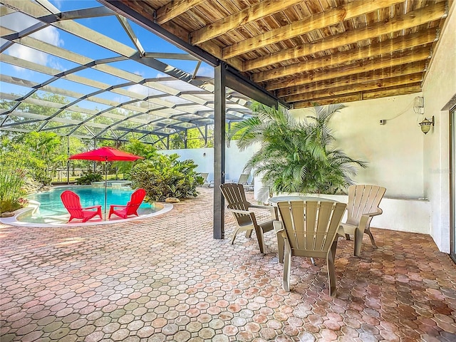 view of patio / terrace with a lanai