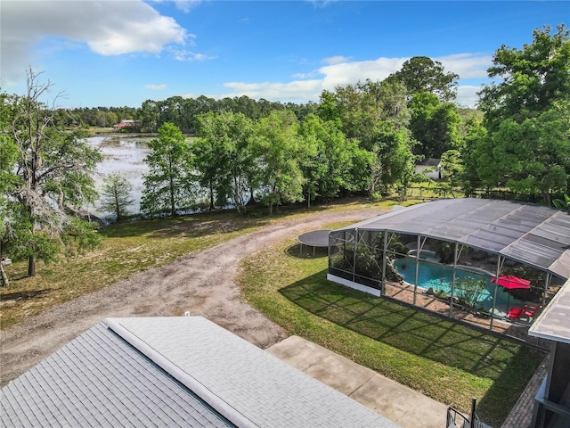 view of community with a pool and a lawn