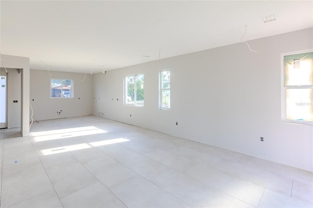 empty room with light tile patterned flooring