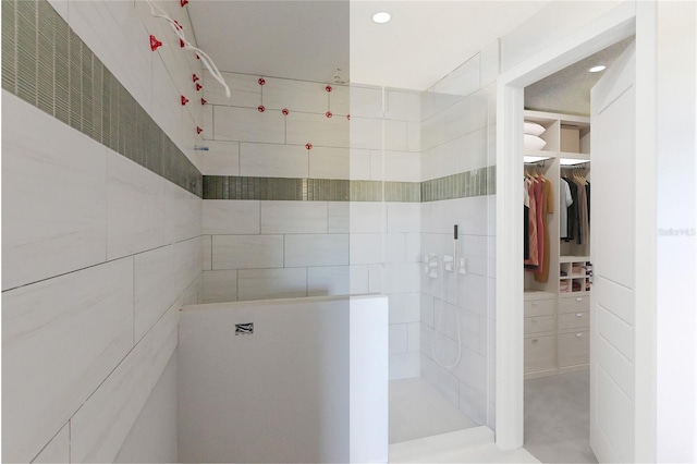 bathroom with a tile shower