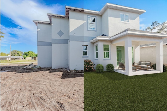 back of house with a patio area and a yard