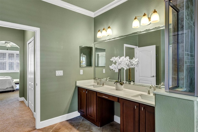 bathroom featuring vanity, tile patterned floors, ceiling fan, and crown molding