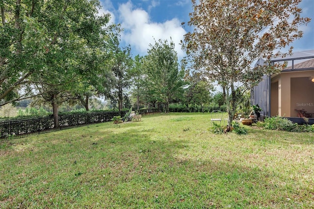 view of yard with a lanai