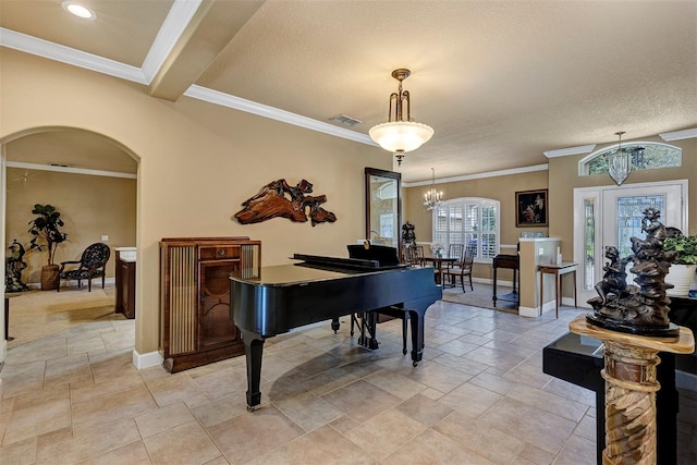 misc room featuring a notable chandelier, beam ceiling, ornamental molding, and a textured ceiling