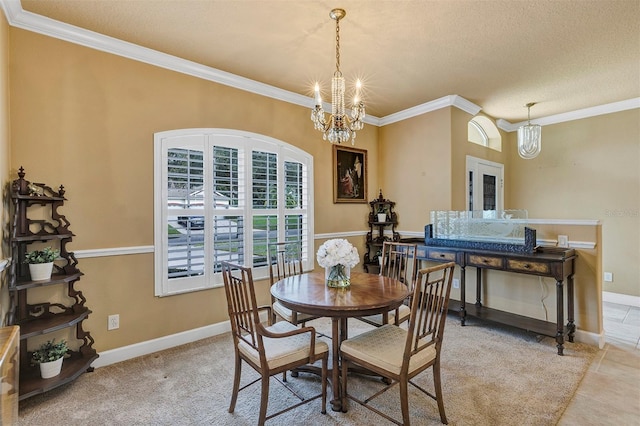 dining room featuring ornamental molding, a textured ceiling, and a notable chandelier