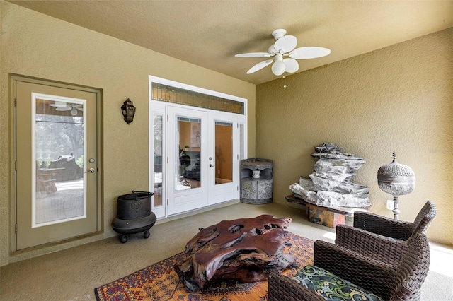 sunroom with french doors and ceiling fan