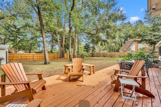 wooden deck with a yard