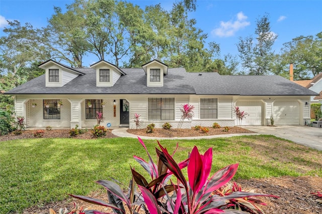 view of front of property with a front lawn and a garage